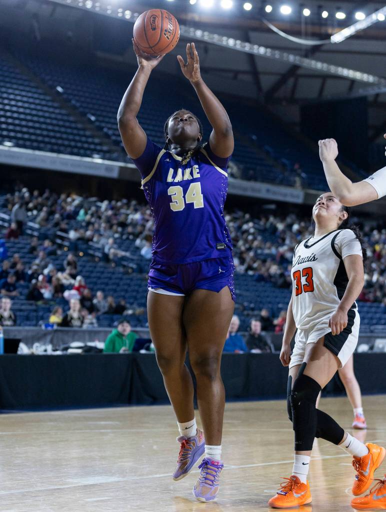 Lake Stevens Dara Olotu lays up the ball during the 4A state quarterfinal game against Davis on Thursday, March 5, 2026 in Tacoma, Washington. (Olivia Vanni / The Herald)