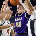 Lake Stevens Kaetyn Riley tries to keep possession of the ball during the 4A state quarterfinal game against Davis on Thursday, March 5, 2026 in Tacoma, Washington. (Olivia Vanni / The Herald)