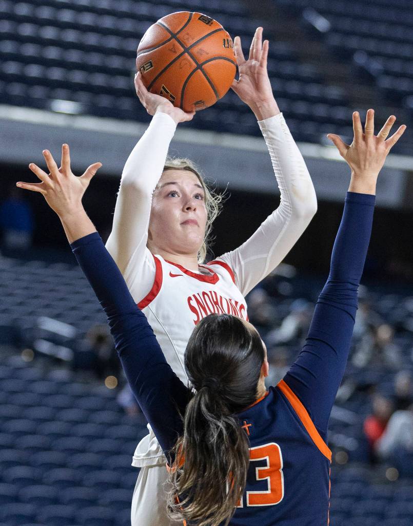 Snohomishs Lola Rotondo takes a jump shot while Eastside Catholics Talia Cermak defends during 3A state semifinal game on Friday, March 6, 2026 in Tacoma, Washington. (Olivia Vanni / The Herald)