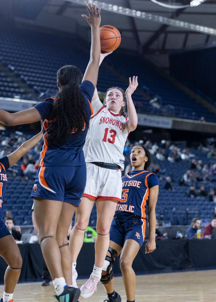 Snohomishs Sienna Capelli takes a jump shot while defends during 3A state semifinal game on Friday, March 6, 2026 in Tacoma, Washington. (Olivia Vanni / The Herald)