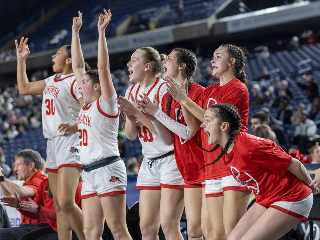 The Snohomish bench reacts to a three-point shot during 3A state semifinal game against Eastside Catholic on Friday, March 6, 2026 in Tacoma, Washington. (Olivia Vanni / The Herald)