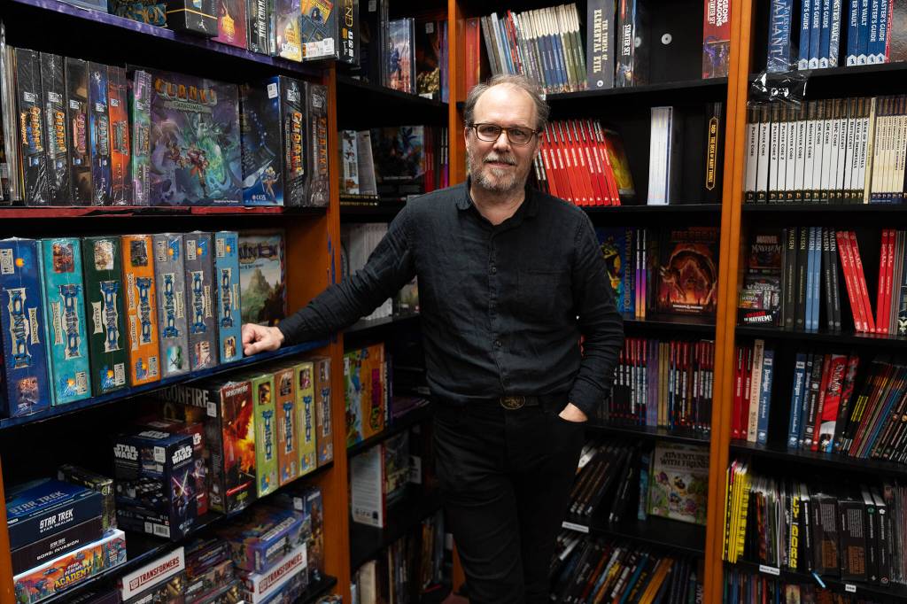 Tim Morgan inside the Around The Table Game Pub on Thursday, Jan. 8 in Lynnwood, Washington. (Will Geschke / The Herald)