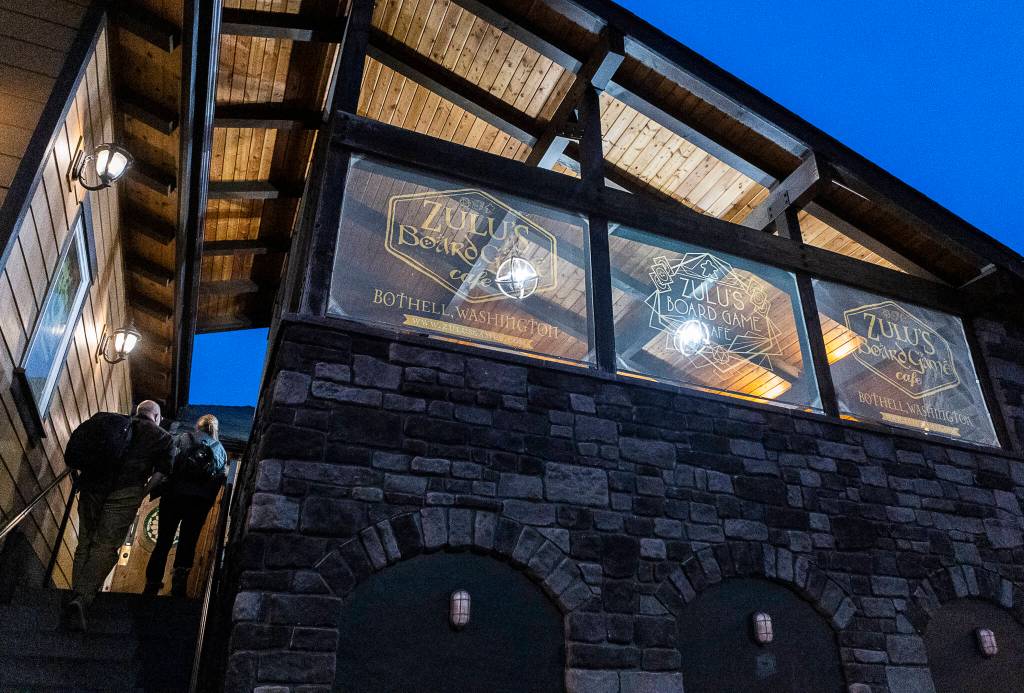 People walk into Zulu’s Board Game Cafe on Friday, Jan. 9, 2026 in Bothell, Washington. (Olivia Vanni / The Herald)