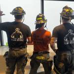 Everett Firefighters look out into the fog over Seattle, Washington from the Columbia Tower Sky View Observatory on March, 8 2026. (Photo courtesy of the Everett Fire Department)