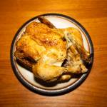 A garlic & herb rotisserie chicken sits on a plate on Tuesday, Jan. 6, 2026 in Edmonds, Washington. (Olivia Vanni / The Herald)