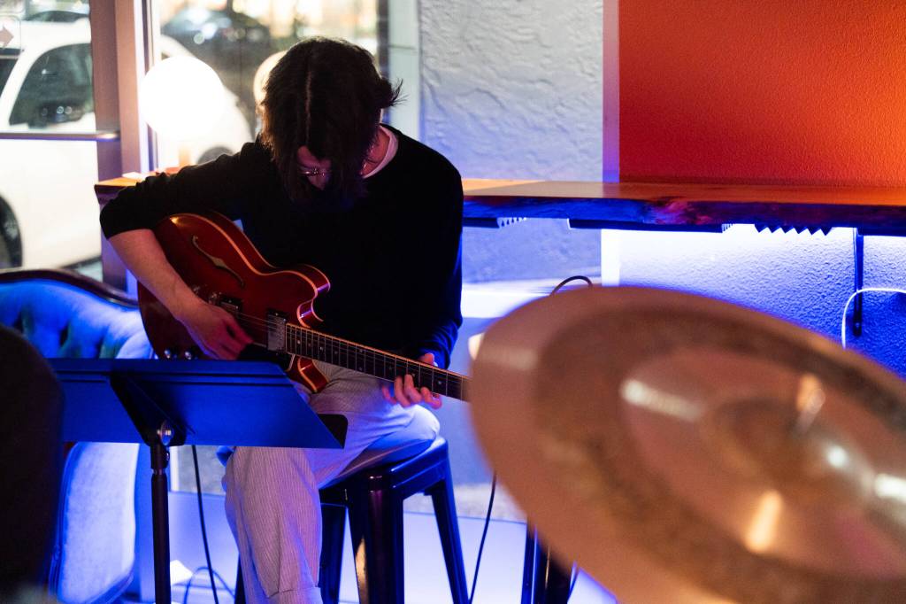 Photos by Will Geschke / The Herald
Luke Gjerde plays guitar on March 6 at Butter Notes Cafe in Everett.