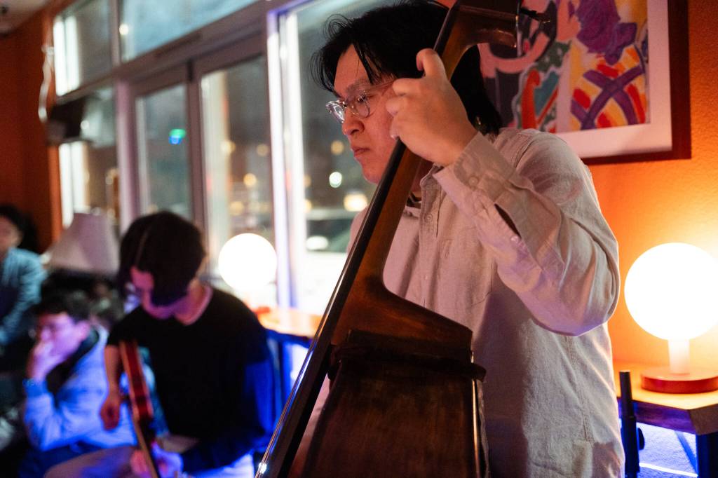 Eric Tran plays bass on March 6 at Butter Notes Cafe in Everett.