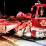 An Everett Fire Department engine rests against a pile of wrecked vehicles after being abandoned by a suspect who stole it and caused significant damage while driving through North Everett in July 2025. (Provided photo)