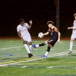 Marysville Getchell junior Karalang Kebbeh (left) blocks a shot from Monroe senior Tony Granados during the Chargers 2-0 loss to the Bearcats at Monroe High School on March 24, 2026. (Joe Pohoryles / The Herald)