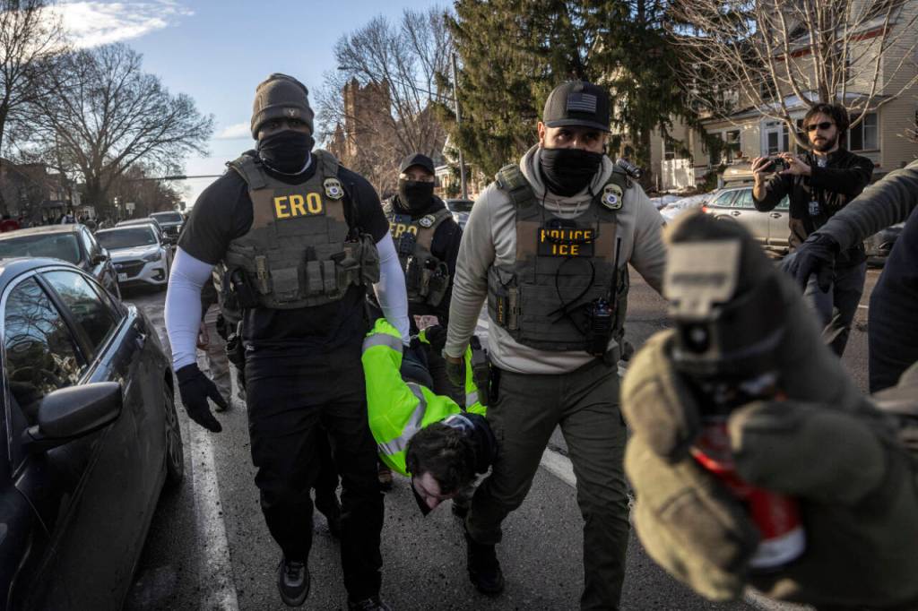Federal agents arrest a protester during an active immigration enforcement operation in a Minneapolis neighborhood, Jan. 13, 2026. The chief federal judge in Minnesota excoriated Immigration and Customs Enforcement on Wednesday, Jan. 28, saying it had violated nearly 100 court orders stemming from its aggressive crackdown in the state and had disobeyed more judicial directives in January alone than some federal agencies have violated in their entire existence. (David Guttenfelder/The New York Times)