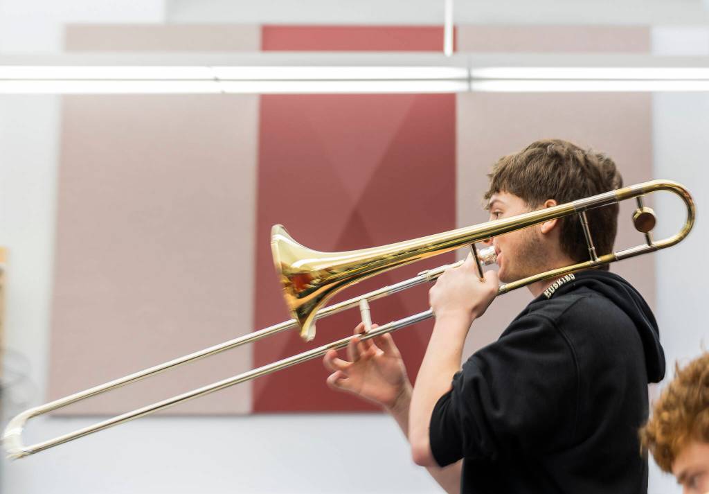Wyatt Gutting plays a trombone during a band workshop at Mountlake Terrace High School on Monday, March 30, 2026 in Mountlake Terrace, Washington. (Olivia Vanni / The Herald)