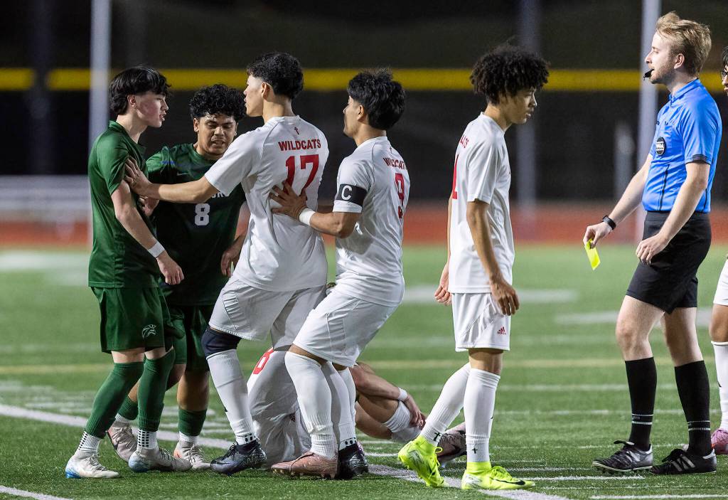 Edmonds-Woodways Jackson Cho and Archbishop Murphys Jason Angel push each other while the refree walks over to give a yellow card during the game on Tuesday, March 31, 2026 in Edmonds, Washington. (Olivia Vanni / The Herald)