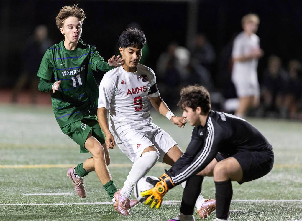 Archbishop Murphys Ivan Hernandez Vazquez shields the ball from Edmonds-Woodways Mason Clark for his goalkeeper during the game on Tuesday, March 31, 2026 in Edmonds, Washington. (Olivia Vanni / The Herald)
