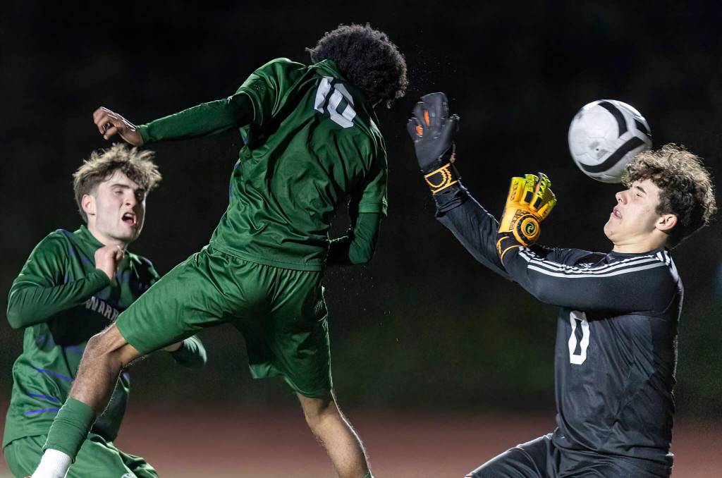 Edmonds-Woodways Natan Ghebreamlak heads the ball past Archbishop Murphys Ben Rincon to score his third goal of the game on Tuesday, March 31, 2026 in Edmonds, Washington. (Olivia Vanni / The Herald)