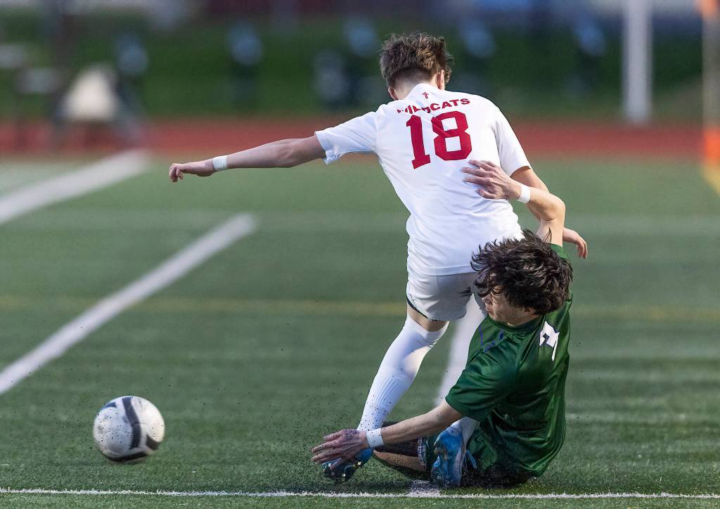 Archbishop Murphys Jacob Bailey tackles Edmonds-Woodways Jackson Cho during the game on Tuesday, March 31, 2026 in Edmonds, Washington. (Olivia Vanni / The Herald)