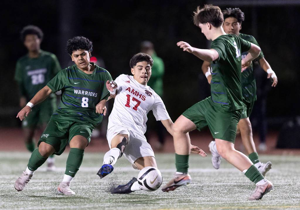 Archbishop Murphys Jason Angel tries to keep control of the ball while Edmonds-Woodways Edgard Perez-Toro defends during the game on Tuesday, March 31, 2026 in Edmonds, Washington. (Olivia Vanni / The Herald)