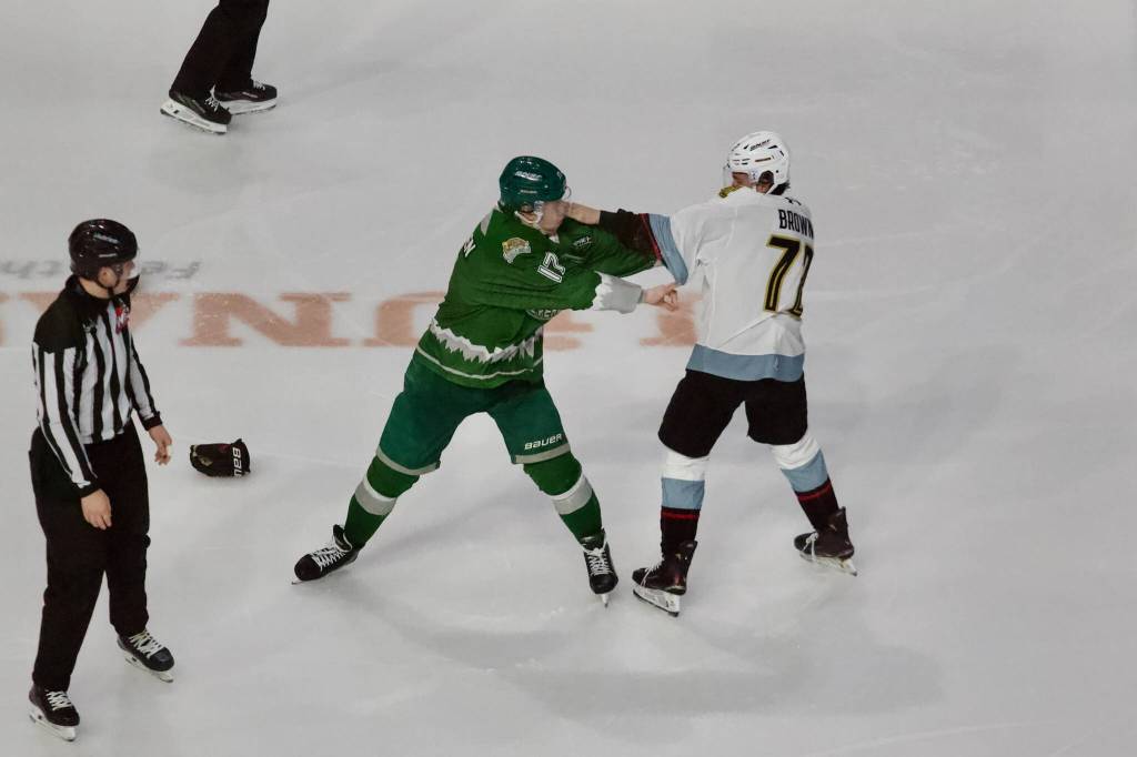 Silvertips forward Julius Miettinen engages in a fight with Winterhawks forward Reed Brown during Everetts 4-1 win against the Portland Winterhawks in Game 2 of the WHL Playoffs First Round at Angel of the Winds Arena on March 28, 2026. (Joe Pohoryles / The Herald)
