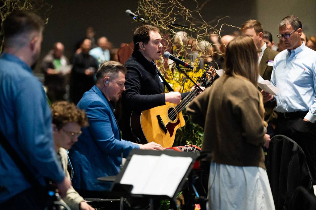 Attendees of the Snohomish County Prayer Breakfast sing on Friday in Everett.
