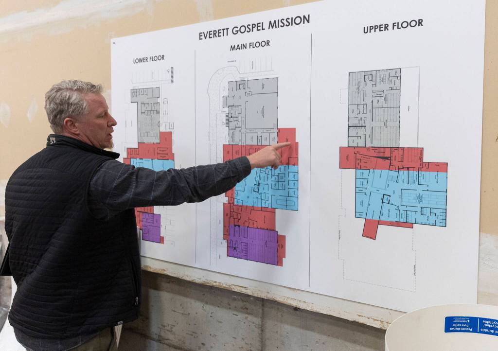 Chivo Hawkins explains how the buildings will be connected during the Everett Gospel Mission expansion on Tuesday, April 7, 2026, in Everett, Washington. (Olivia Vanni / The Herald)