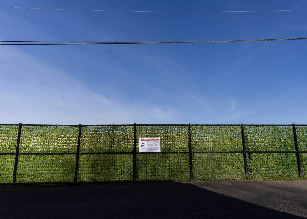 A notice of land application sign hangs on a fence outside of the Everett Gospel Mission on Tuesday, April 7, 2026, in Everett, Washington. (Olivia Vanni / The Herald)