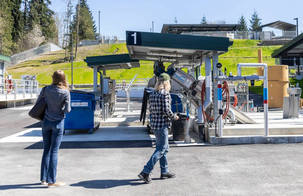 People explore some of the new additions at the Granite Falls Wastewater Treatment Plant on Thursday, April 9, 2026, in Granite Falls, Washington. (Olivia Vanni / The Herald)