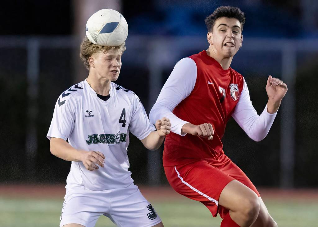 Jacksons Peter Jackson heads the ball against Snohomishs Thomas Pursel during the game on Monday, April 6, 2026 in Snohomish, Washington. (Olivia Vanni / The Herald)
