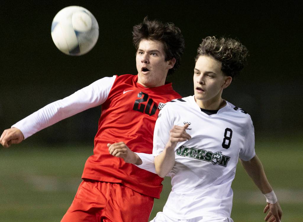 Snohomishs Sonteyago Seeley and Jacksons Santiago Mendoza run after the ball during the game on Monday, April 6, 2026 in Snohomish, Washington. (Olivia Vanni / The Herald)