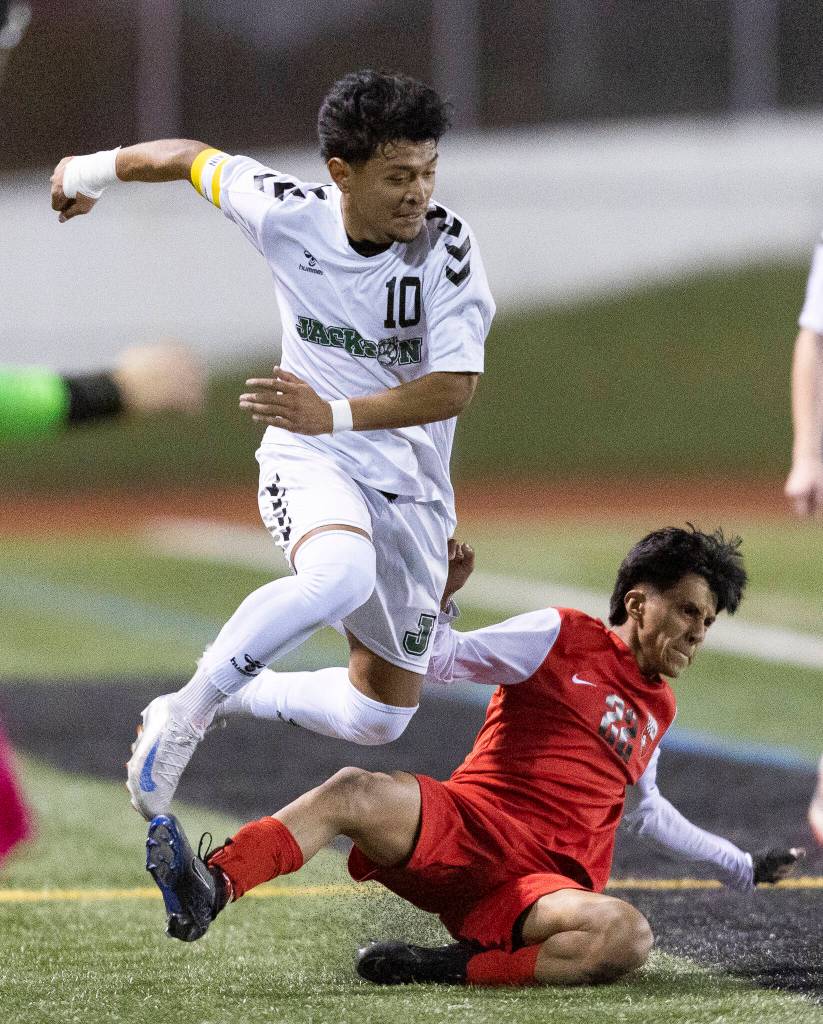 Snohomishs Luis Arceno-Leon slide tackles and fouls Jacksons Anthony Gonzalez-Marroquin during the game on Monday, April 6, 2026 in Snohomish, Washington. (Olivia Vanni / The Herald)