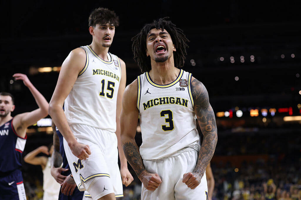 Michigan fights off UConn to win men’s basketball title