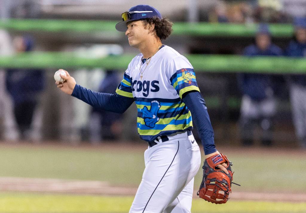 Luis Suisbel (8) of the Everett AquaSox reacts after another score crosses home plate during the game against the Tri-City Dust Devils on Tuesday, April 7, 2026 in Everett, Washington. (Olivia Vanni / The Herald)