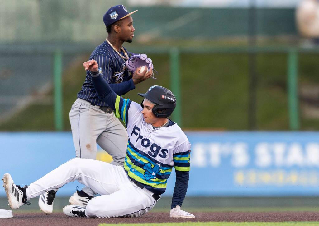 Jonny Farmelo (15) of the Everett AquaSox is forced out aS he slides into second base during the game against the Tri-City Dust Devils on Tuesday, April 7, 2026 in Everett, Washington. (Olivia Vanni / The Herald)