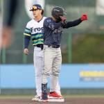 A Tri-City Dust Devils player motions to his dugout on Tuesday, April 7, 2026 in Everett, Washington. (Olivia Vanni / The Herald)