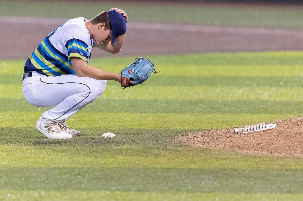 Calvin Schapira (25) of the Everett AquaSox looks on while pitching during the game against the Tri-City Dust Devils on Tuesday, April 7, 2026 in Everett, Washington. (Olivia Vanni / The Herald)