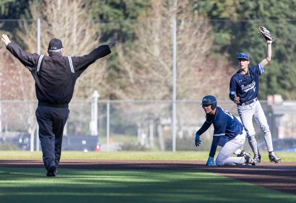 Glacier Peaks Lucas Keller is called safe at second base during the game against Meadowdale on Wednesday, April 8, 2026 in Lynnwood, Washington. (Olivia Vanni / The Herald)