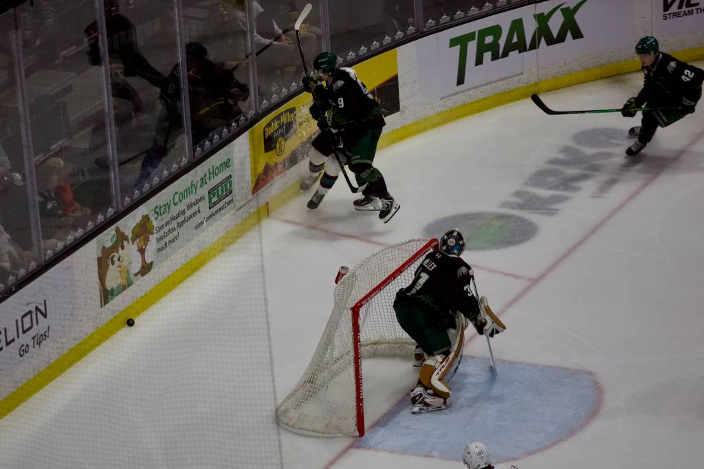 Silvertips defenseman Landon DuPont delivers a hit on a Rockets player along the end boards during Everetts 4-1 win against Kelowna in Game 1 of the WHL Playoffs Western Conference semifinals at Angel of the Winds Arena on April 10, 2026. (Joe Pohoryles / The Herald)
