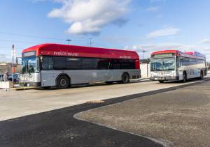 An Everett Transit bus drives away from Mall Station on Monday, Dec. 22, 2025 in Everett, Washington. (Olivia Vanni / The Herald)