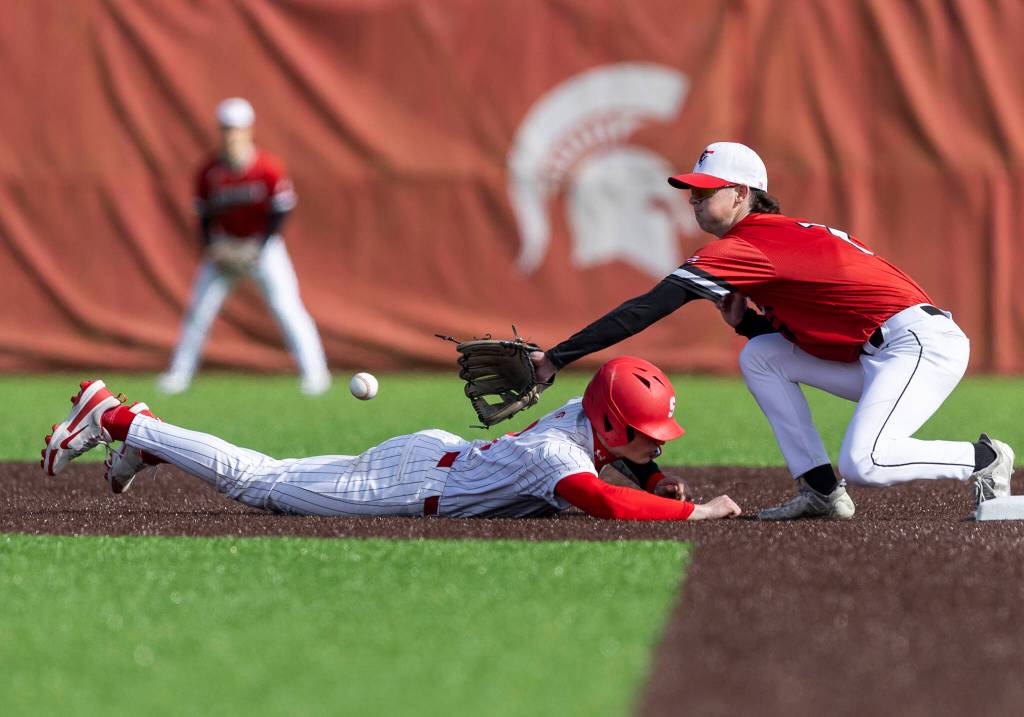 Stanwoods Grady Lamb dives back to second base during the game against Mountlake Terrace on Wednesday, April 15, 2026 in Stanwood, Washington. (Olivia Vanni / The Herald)