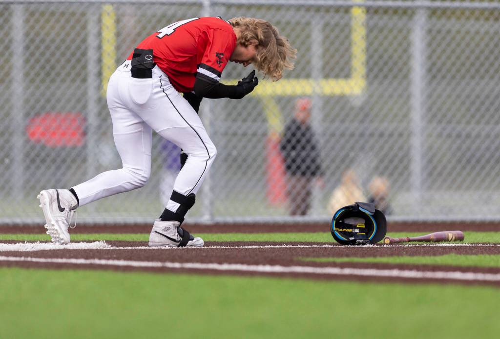 Mountlake Terraces Kaden Fleming reacts after fouling the ball off of his foot during the game against Stanwood on Wednesday, April 15, 2026 in Stanwood, Washington. (Olivia Vanni / The Herald)