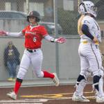 Snohomishs Kamryn Best crosses home plate to score on a walked run during the game against Everett on Thursday, April 16, 2026 in Everett, Washington. (Olivia Vanni / The Herald)