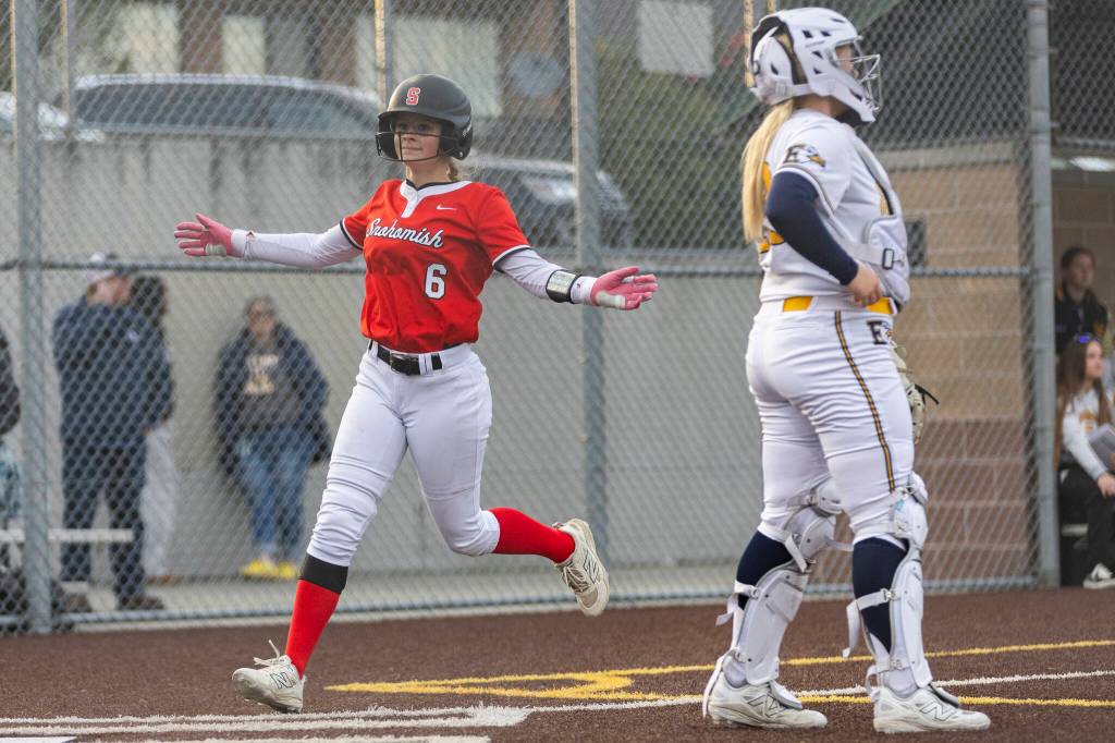Snohomishs Kamryn Best crosses home plate to score on a walked run during the game against Everett on Thursday, April 16, 2026 in Everett, Washington. (Olivia Vanni / The Herald)