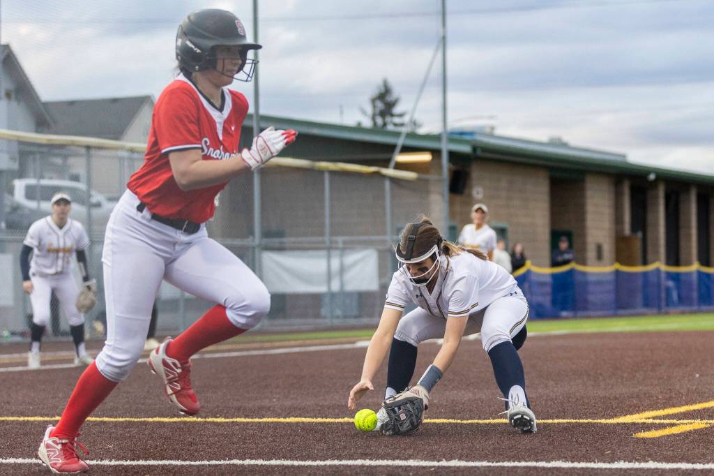Everetts Anna Luscher runs up to pick up a bunt during the game against Snohomish on Thursday, April 16, 2026 in Everett, Washington. (Olivia Vanni / The Herald)