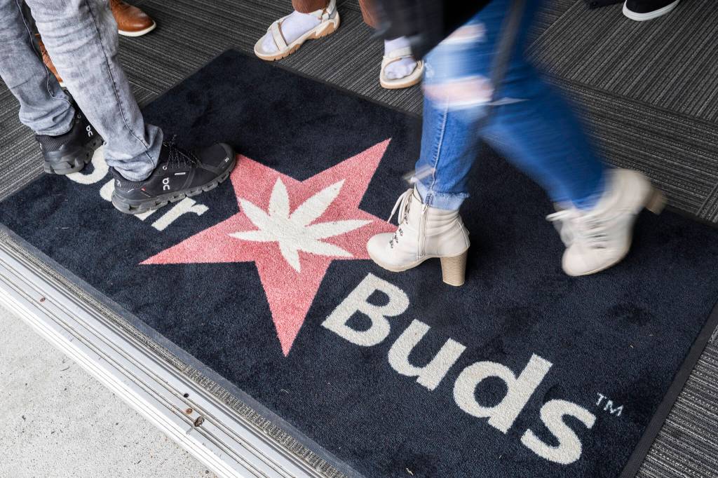 People walk around Starbuds on Monday, April 20, 2026 in Lynnwood, Washington. (Olivia Vanni / The Herald)