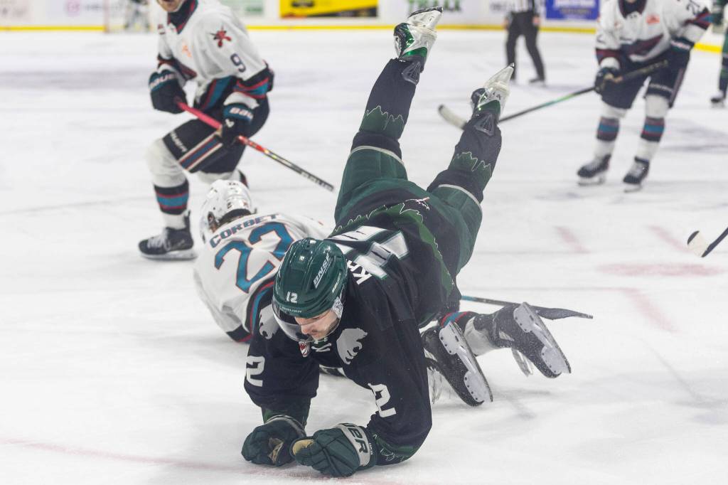 Lukas Kaplan #12 of the Everett Silvertips dives over Nate Corbet #22 of the Kelowna Rockets during Game 5 of the Western Hockey League second round on Friday, April 17, 2026 in Everett, Washington. (Olivia Vanni / The Herald)