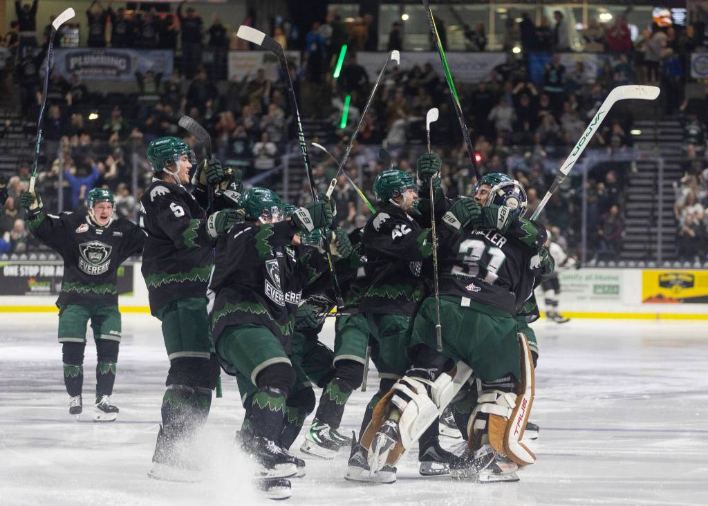 Landon DuPont #9 of the Everett Silvertips and Anders Miller #31 of the Everett Silvertips, along with other teammates, celebrate after beating the Kelowna Rockets in Game 5 of the Western Hockey League second round to advance to the Western Conference Finals on Friday, April 17, 2026 in Everett, Washington. (Olivia Vanni / The Herald)