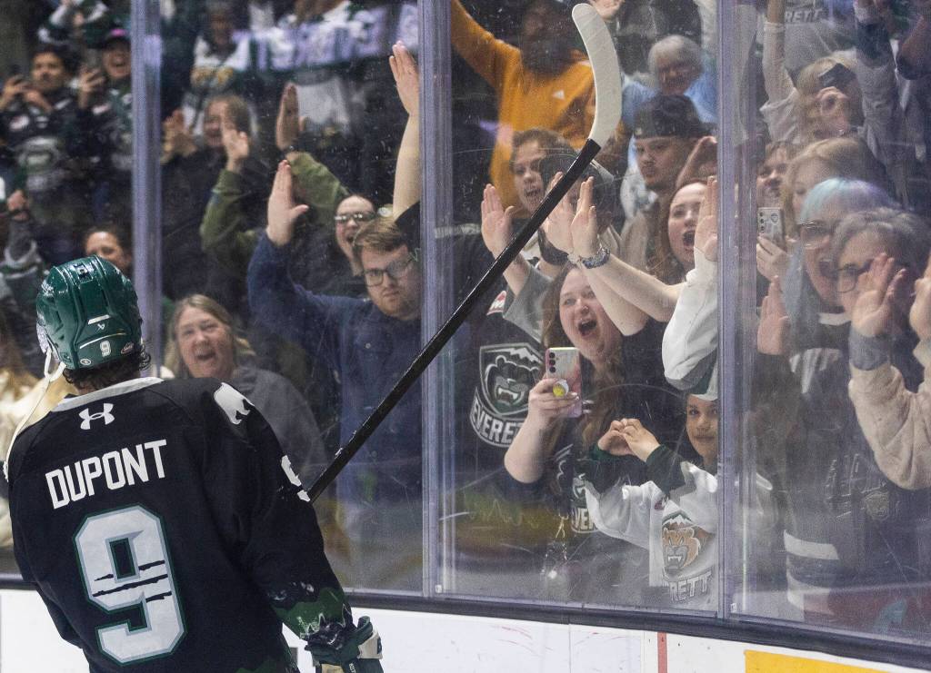 Landon DuPont #9 of the Everett Silvertips and Anders Miller #31 of the Everett Silvertips, along with other teammates, celebrate after beating the Kelowna Rockets in Game 5 of the Western Hockey League second round to advance to the Western Conference Finals on Friday, April 17, 2026 in Everett, Washington. (Olivia Vanni / The Herald)
Landon DuPont #9 of the Everett Silvertips celebrates with fans after beating the Kelowna Rockets in Game 5 of the Western Hockey League second round to advance to the Western Conference Finals on Friday, April 17, 2026 in Everett, Washington. (Olivia Vanni / The Herald)