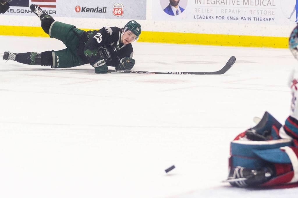 Rhys Jamieson #25 of the Everett Silvertips falls to the ice after shooting the puck during Game 5 of the Western Hockey League second round against the Kelowna Rockets on Friday, April 17, 2026 in Everett, Washington. (Olivia Vanni / The Herald)