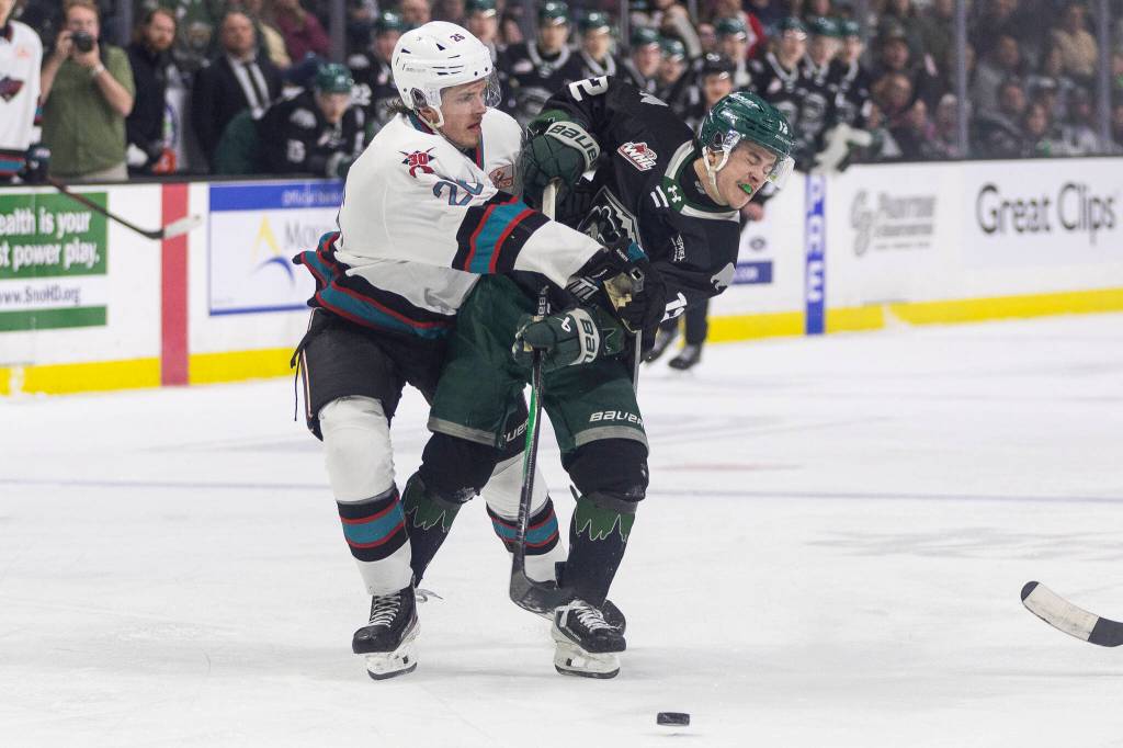 Rowan Guest #26 of the Kelowna Rockets and Lukas Kaplan #12 of the Everett Silvertips battle for the puck during Game 5 of the Western Hockey League second round on Friday, April 17, 2026 in Everett, Washington. (Olivia Vanni / The Herald)