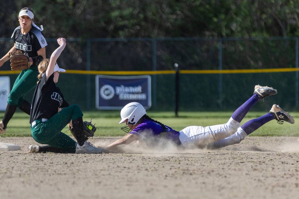 Jacksons Nicole Burnett tags out Kamiaks Riley Karabach while she slides into second during the game on Monday, April 20, 2026 in Mill Creek, Washington. (Olivia Vanni / The Herald)