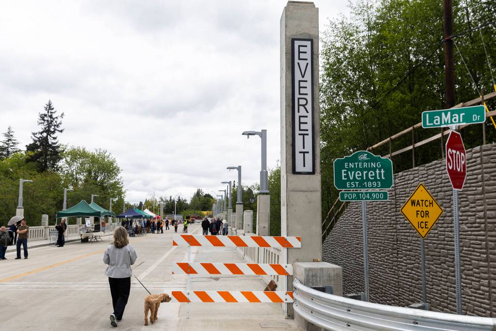 A person steps onto the new Edgewater Bridge from the Mukilteo side on Monday, April 27, 2026, in Everett, Washington. (Olivia Vanni / The Herald)