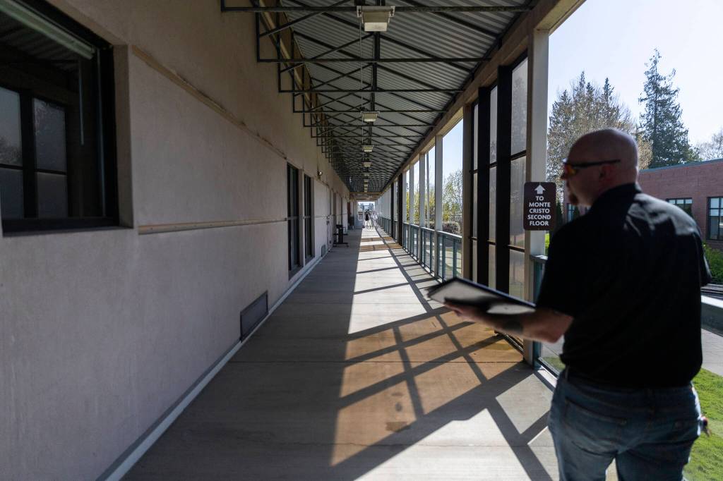 The outside corridor of the old Baker Hall on Friday, April 24, 2026 in Everett, Washington. (Olivia Vanni / The Herald)